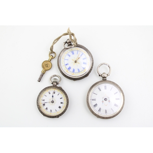 23 - Three silver lady's fob watches, two sterling and one 0.935, ornate decoration, largest 39mm (3).