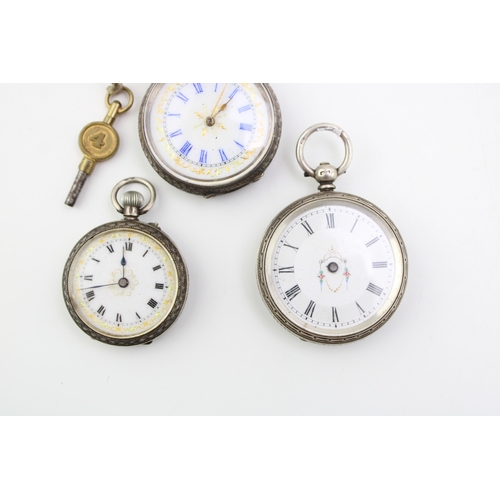 23 - Three silver lady's fob watches, two sterling and one 0.935, ornate decoration, largest 39mm (3).