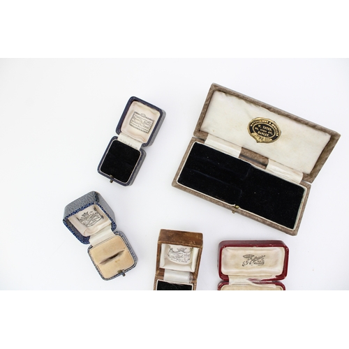 231 - A collection of antique jewellery boxes to include The Clock Shop Rhyl ring box, Knupfer Bros ring b... 