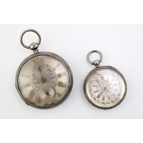 24 - Two silver pocket watches, yellow metal coloured numerals, both key wind, largest 54mm (2), both unt... 