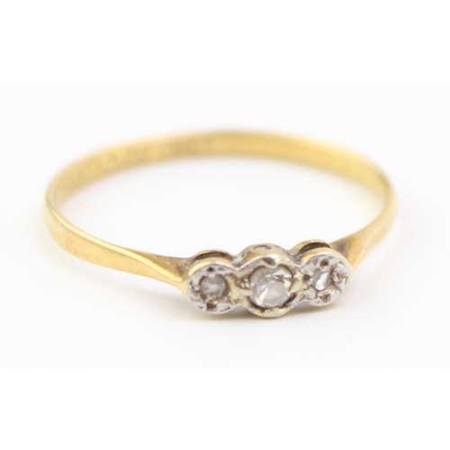 240 - 18ct gold and platinum ring, set with three diamonds, 1.1g, size M.