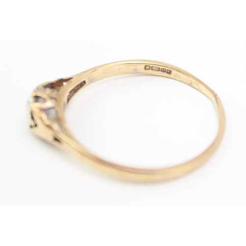 245 - 9ct gold diamond solitaire ring, stone is approx. 1/10ct, in rub over setting, size Q, 1.3g.