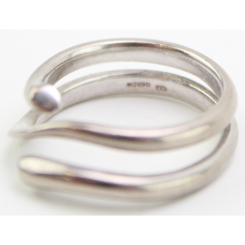 249 - An 18ct white gold 'Magic' ring, by Georg Jensen,
of coiled court section form, with a knife edge ce... 