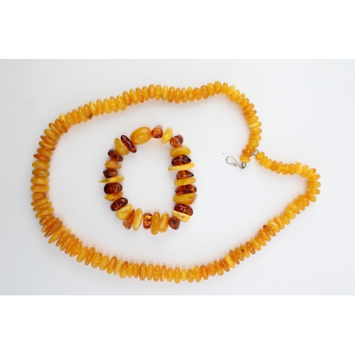 263 - Two strings of butterscotch and clear amber, comprising a string of uneven button beads, total weigh... 