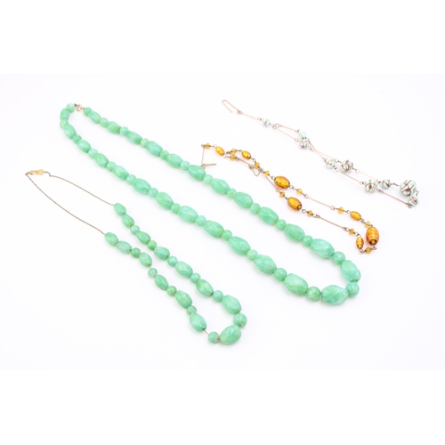 281 - A group of vintage bead necklaces, comprising two with green marbled glass beads, resembling jade, a... 