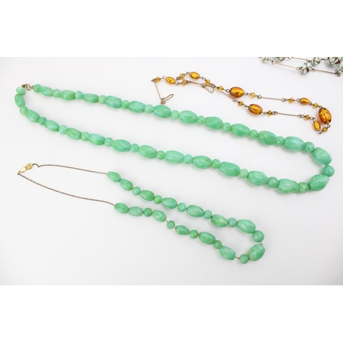 281 - A group of vintage bead necklaces, comprising two with green marbled glass beads, resembling jade, a... 