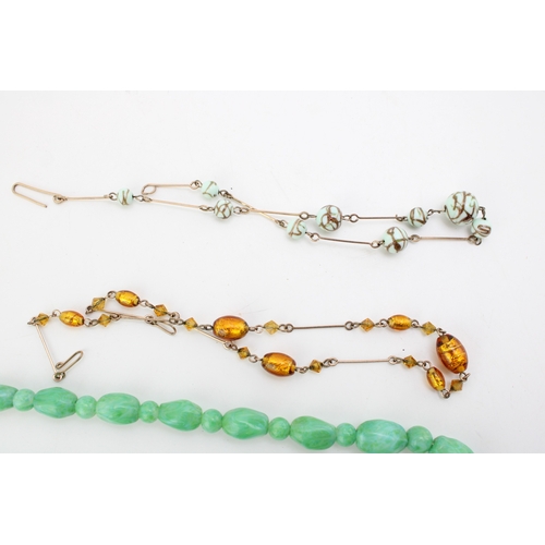 281 - A group of vintage bead necklaces, comprising two with green marbled glass beads, resembling jade, a... 