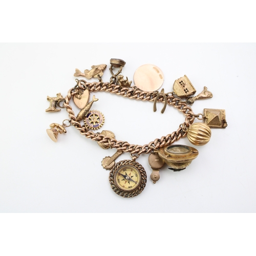 283 - A 9ct gold curb link charm bracelet with eighteen charms, including pyramid which opens to reveal mu... 