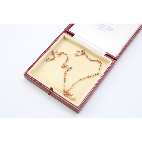 285 - A child's 9ct gold, seed pearl and coral necklace, possibly Victorian, 37cm long, 6.3g.