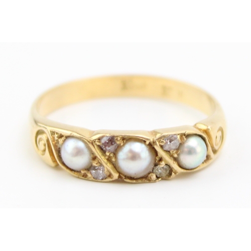 294 - An 18ct gold, pearl and diamond brilliant ring, size M/N, 3.0g.