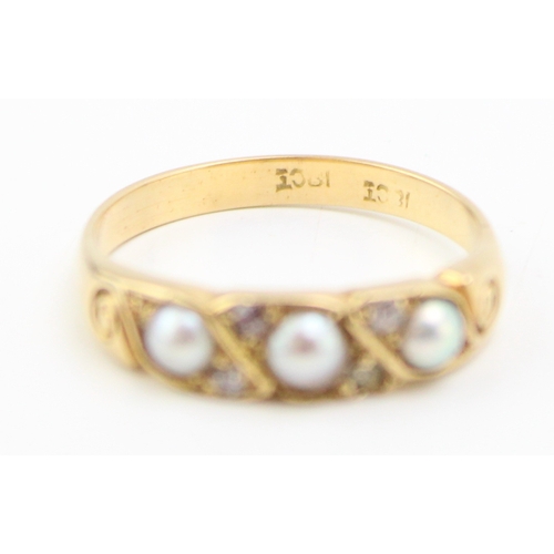 294 - An 18ct gold, pearl and diamond brilliant ring, size M/N, 3.0g.