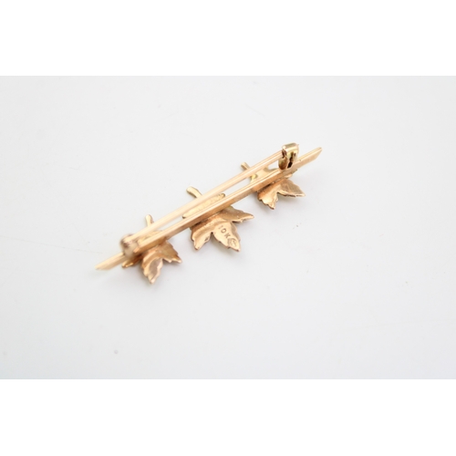 295 - A 10ct gold brooch in the form of three maple leaves with tri-tone textured decoration, 2.1g, 3.9cm ... 