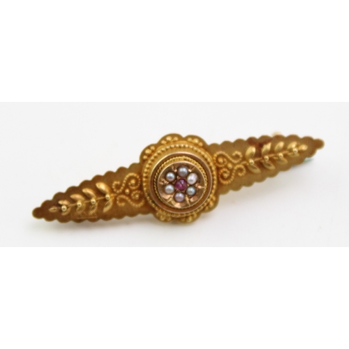 304 - 15ct gold sweetheart brooch, raised centre, set ruby and seed pearls, steel pin, 1.9g, 39mm wide.