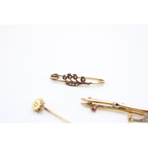 305 - Two 9ct gold sweetheart brooches, one a floral example set with seed pearls, the other set with rubi... 