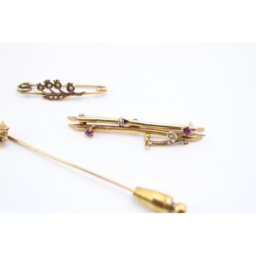 305 - Two 9ct gold sweetheart brooches, one a floral example set with seed pearls, the other set with rubi... 