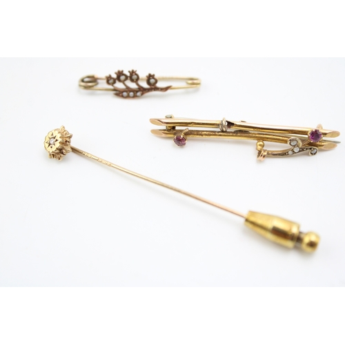 305 - Two 9ct gold sweetheart brooches, one a floral example set with seed pearls, the other set with rubi... 