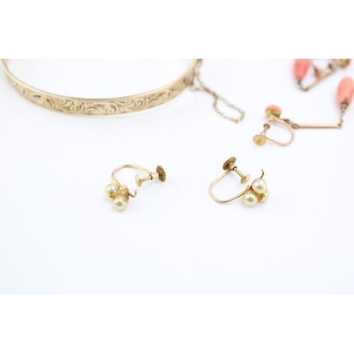 311 - Two pairs of 9ct yellow gold earrings to include a pair with coral beads and a pair with cultured pe... 