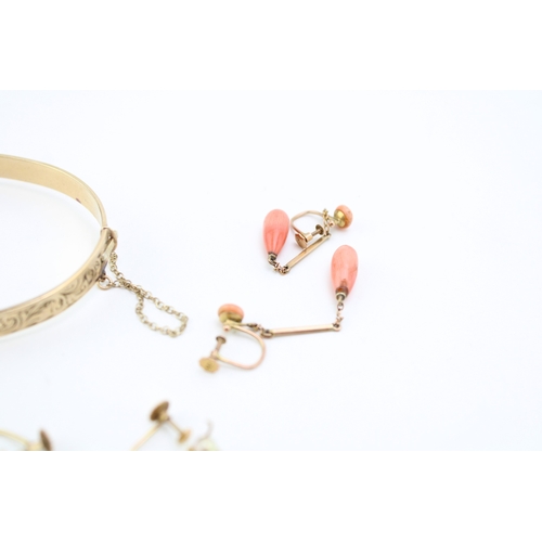 311 - Two pairs of 9ct yellow gold earrings to include a pair with coral beads and a pair with cultured pe... 