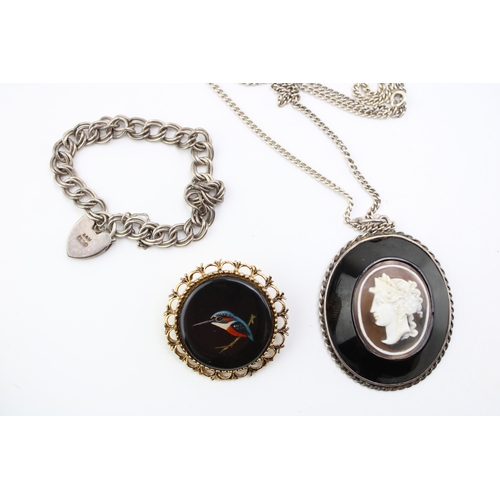 315 - An antique cameo pendant in silver mount on silver chain together with an antique silver bracelet wi... 