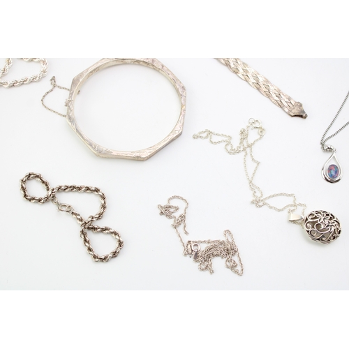 324 - A mixed collection of silver jewellery items to include necklaces, bangles, pendants, bracelets and ... 