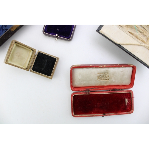 329 - A collection of antique push button and similar jewellery boxes, of note Watchmakers and Jewellers b... 