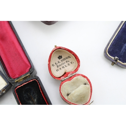 331 - A collection of antique push button and similar jewellery boxes, of note red antique heart shaped ri... 