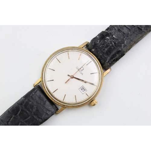 37 - A vintage Omega gentleman's wristwatch the signed champagne dial with baton numerals, minute track a... 