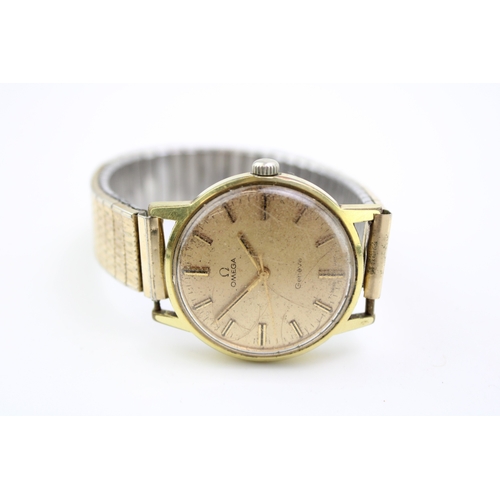 38 - A gentleman's vintage Omega wristwatch, the signed gold coloured dial with baton markers and minute ... 