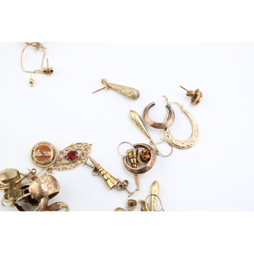 384 - 13 pairs x earrings which appear to be possibly gold, but have no hallmarks, 24.4g.  So some may be ... 