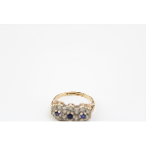 413 - 9ct gold blue & white stone set ring size M, 3.4g, flower head form.