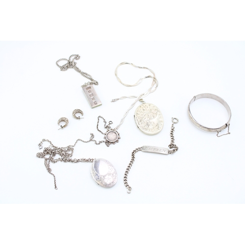 427 - Group of hallmarked sterling silver jewellery including locket, ingot, chain, ID bracelet, bangle, c... 