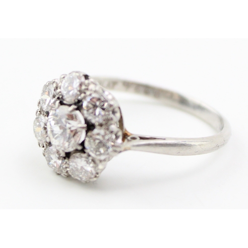 429 - An early Art Deco style diamond and platinum flowerhead ring, approximate diameter 4.9mm, surrounded... 