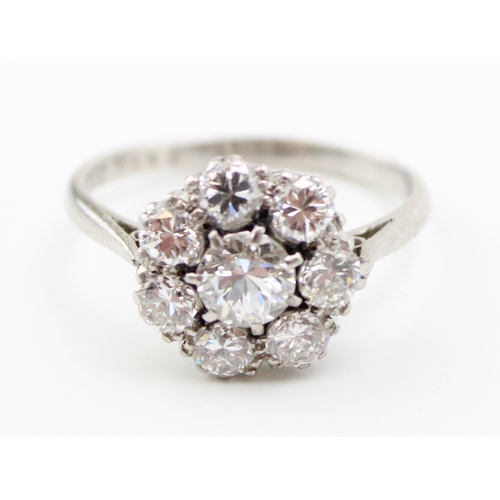 429 - An early Art Deco style diamond and platinum flowerhead ring, approximate diameter 4.9mm, surrounded... 