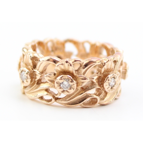 431 - A 14ct rose gold and diamond ring, the wide band 8.7mm, of pierced foliate design in the Welsh manne... 