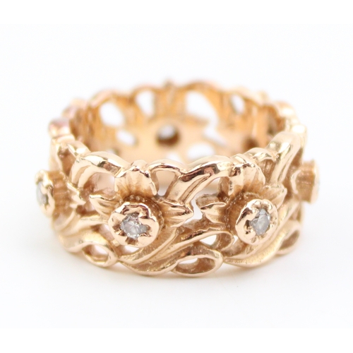 431 - A 14ct rose gold and diamond ring, the wide band 8.7mm, of pierced foliate design in the Welsh manne... 