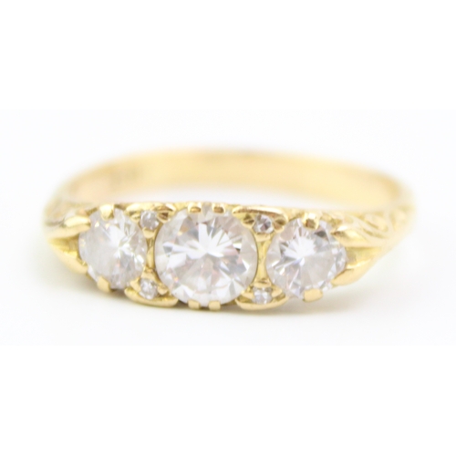 439 - An 18ct gold and diamond three stone dress ring, the central stone of approximately 5.7mm diameter, ... 