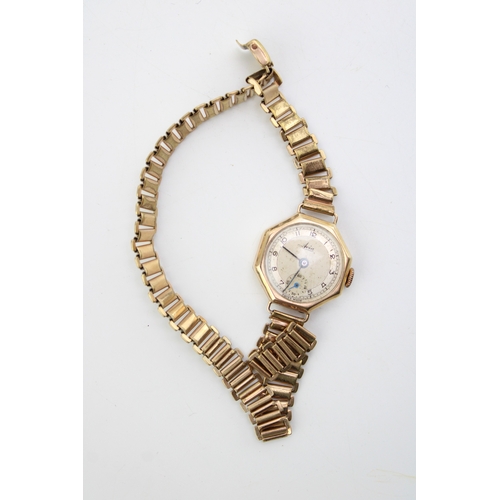 440 - A lady's Avia 9ct gold cased cocktail watch with rolled gold bracelet strap, the signed octagonal di... 