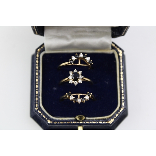 442 - A Brooks and Bentley Sapphire Splendour Triple Ring, comprising a central dress ring set with oval s... 