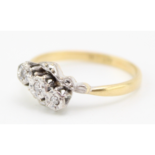 443 - An 18ct gold, platinum and diamond vintage three stone ring, illusion set, size O/P, 2.9g.