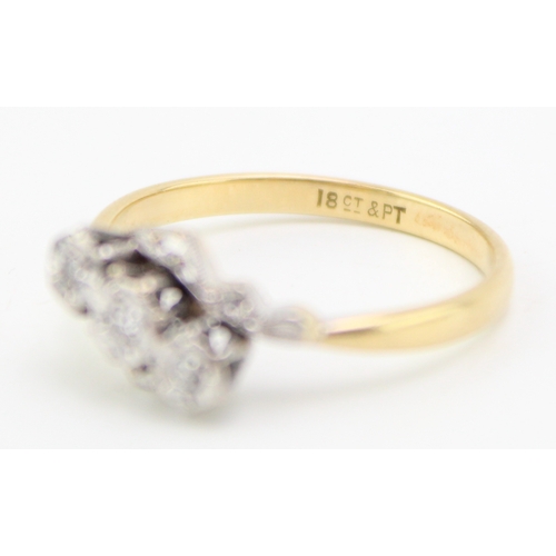 443 - An 18ct gold, platinum and diamond vintage three stone ring, illusion set, size O/P, 2.9g.