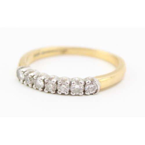 444 - An 18ct gold and diamond seven stone ring, size Q, 3.4g.