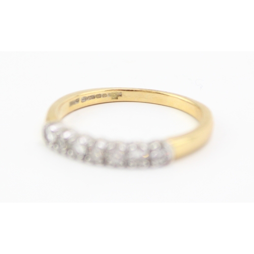 444 - An 18ct gold and diamond seven stone ring, size Q, 3.4g.