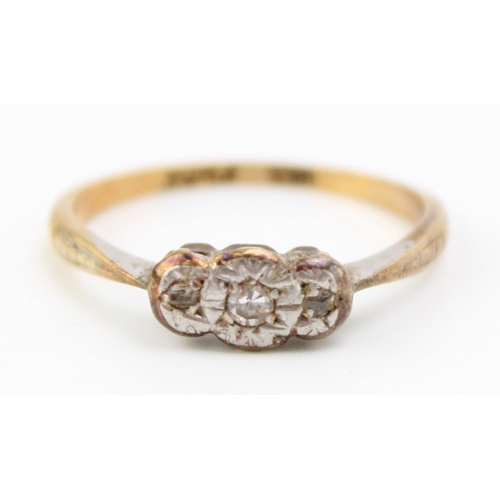 447 - An 18ct gold, platinum and diamond vintage three stone ring, illusion set, size L/M, 1.8g.