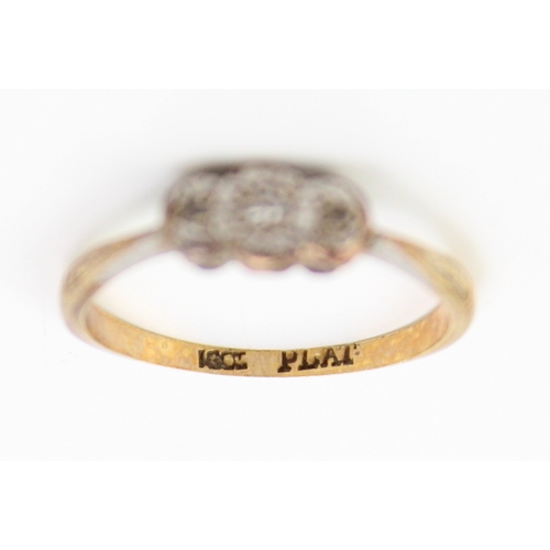 447 - An 18ct gold, platinum and diamond vintage three stone ring, illusion set, size L/M, 1.8g.