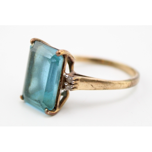 455 - A vintage 9ct gold, topaz and diamond set dress ring, the emerald stone of approximately 14.1 by 10.... 