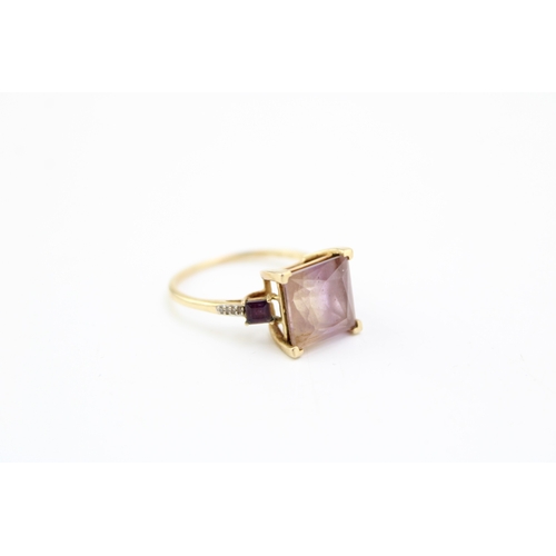 456 - A 9ct gold, tourmaline, amethyst and diamond dress ring, the large emerald cut tourmaline with disti... 