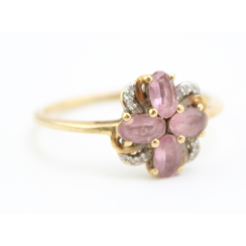 460 - A vintage 9ct gold, rose quartz or amethyst and diamond set flowerhead ring, of four petalled form w... 