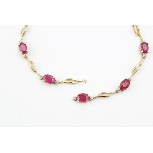 479 - A 9ct gold and ruby bracelet, set with seven oval cut rubies, 19cm long, a/f broken but both parts p... 