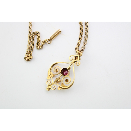 490 - A 9ct gold, Art Nouveau garnet and seed pearl set scroll pendant on 9ct gold belcher link chain, wit... 