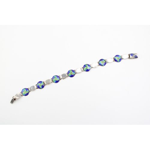 492 - An Art Nouveau silver and enamel bracelet, by Stainton Brothers, set with seven enamelled roundels i... 